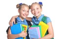 Cute schoolgirls with backpacks