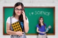 Cute science nerd in a classroom Royalty Free Stock Photo