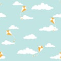 Cute seamless ornament with white clouds and kites on powder blue background