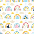 Cute seamless pattern with baby rainbows, clouds, sun, rain