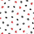 Cute seamless pattern with cat heads, hearts and paw prints. Royalty Free Stock Photo