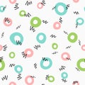 Cute seamless pattern with circles and abstract scribbles drawn by hand.