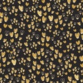 Cute seamless pattern from gold repeating hearts on black background. Royalty Free Stock Photo
