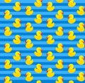 Cute seamless pattern with yellow rubber duck on blue background.