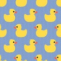 Cute seamless pattern with yellow rubber duck on wave background.