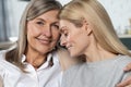 Cute senior woman and her adult daughter hugging and smiling Royalty Free Stock Photo