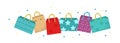 Cute shopping bag banner. Colorful shopping bags with different design board. Gift package with space for text. Vector Royalty Free Stock Photo