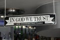 Cute sign posted in a restaurant `In God we trust, all others pay cash`. Royalty Free Stock Photo