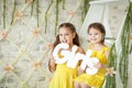 Cute little girls in spring studio