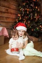 Cute sisters playing with a gift box Royalty Free Stock Photo