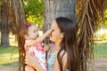 Cute sisters teen and baby girl playing in park Royalty Free Stock Photo