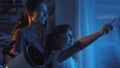 Cute sisters watching the stars with a telescope