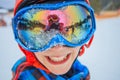 Cute skier boy in a winter ski resort. Royalty Free Stock Photo