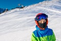 Cute skier boy in a winter ski resort. Royalty Free Stock Photo