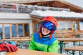 Cute skier boy in a winter ski resort. Royalty Free Stock Photo