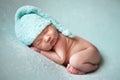 Newborn baby asian boy sleeping at blue background Royalty Free Stock Photo