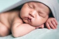 Newborn baby asian boy sleeping at blue background Royalty Free Stock Photo