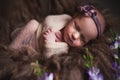Infant baby girl sleeping at background. Newborn and mothercare concept