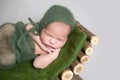 Sleeping newborn baby on wooden crib. Royalty Free Stock Photo