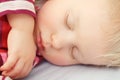 Cute sleeping blond baby