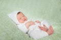 Cute sleeping newborn baby in white knitted fluffy kitten costume Royalty Free Stock Photo