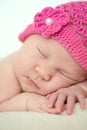 Cute sleeping newborn girl in pink hat, close-up Royalty Free Stock Photo