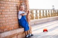 Cute small blond boy is playing Royalty Free Stock Photo