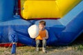 Cute small boy enjoying a stick of candy floss Royalty Free Stock Photo