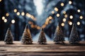 Cute small christmas tree decorations against the defocused background of an illuminated street with copy space