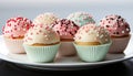 A cute, small cupcake with pink icing and multi colored decoration generated by AI