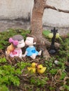 Cute small dolls duck street lights tree park roots teddy