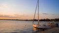 Cute small fishing boats laying on bulgarian port at colorful sunset creating a perfect balkanian summer vacation memory. Royalty Free Stock Photo