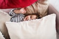 A small happy girl in striped T-shirt at home having fun. Royalty Free Stock Photo