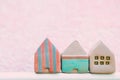 cute small house toy with pink copy space for text for postcard home and community background