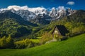 Cute small hut on the slope and snowy mountains, Slovenia Royalty Free Stock Photo