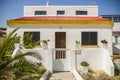 Cute small Portuguese house on Farol island, Faro, Algarve, Portugal Royalty Free Stock Photo