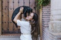 Cute small sausage dog sitting outdoors with her owner at home. lovely dog kissing owner. Love for animals concept Royalty Free Stock Photo