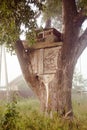 Cute small tree house for kids on backyard. Royalty Free Stock Photo