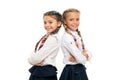 Cute but smart. Adorable little girls smiling isolated on white. Happy small girls wearing school uniform. Primary