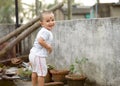 Cute smart naughty baby making a funny and looking at camera. Happy baby background Royalty Free Stock Photo