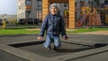 Cute smiing boy jumping and having fun on outdoor trampoline at park. Concept of child development, sports and education Royalty Free Stock Photo