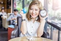 Cute smiling asia girl with globe and alarm clock Royalty Free Stock Photo