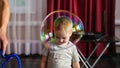 Cute smiling baby with big soap bubble Royalty Free Stock Photo