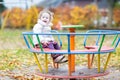 Cute smiling baby girl having fun at the playground Royalty Free Stock Photo