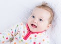 Cute smiling baby girl wearing a warm winter jacket Royalty Free Stock Photo