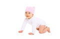 Cute smiling baby in hat crawls on white background