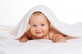 Cute smiling baby lying on towel isolated on white Royalty Free Stock Photo