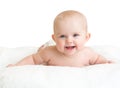 Cute smiling baby lying on white towel Royalty Free Stock Photo