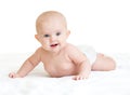 Cute smiling baby lying on white towel in nappy Royalty Free Stock Photo