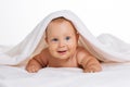 Cute smiling baby under towel after bath Royalty Free Stock Photo